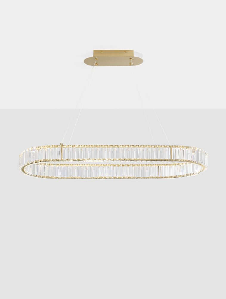 Aurelia LED Pendelleuchte 3500K mit goldfarbenem Metallgestell und Glasstäben.