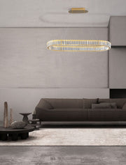 Aurelia LED pendant light 3500K above a modern living room with a stylish sofa and minimalist decor.