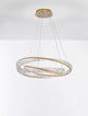 Aurelia LED Pendelleuchte 3500K Gold mit goldenen Ringen und facettierten Glasstäben.
