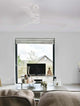 Axel Ventilator Ø 137 im modernen Wohnraum mit eleganter Einrichtung und großem Fenster.