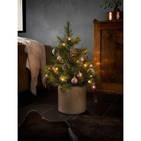 Tree garland top bulbs twisted tip, One String 20 clear bulbs on a small Christmas tree in festive decoration.