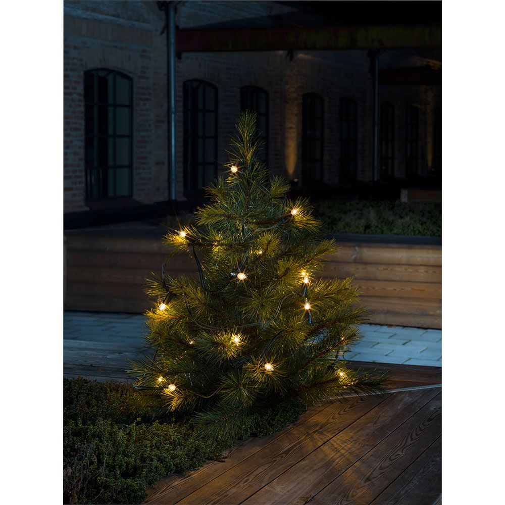 Baumkette Topbirnen mit 20 klaren Birnen, geschmückter Weihnachtsbaum im Außenbereich bei Nacht.