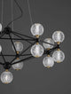 Belinda LED Pendelleuchte Ø 105cm 17-flammig mit geometrischem Design und gläsernen Kugellampen.