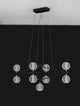Belinda LED Pendelleuchte 9-flammig mit geometrischem Design und gläsernen Lampenschirmen. Perfekt für moderne Innenräume.