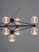 Belinda LED Pendelleuchte 9-flammig mit modernem geometrischen Design und klaren Glaskugeln.
