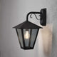 Benu outdoor wall lamp black, smoked acrylic glass mounted on a wall