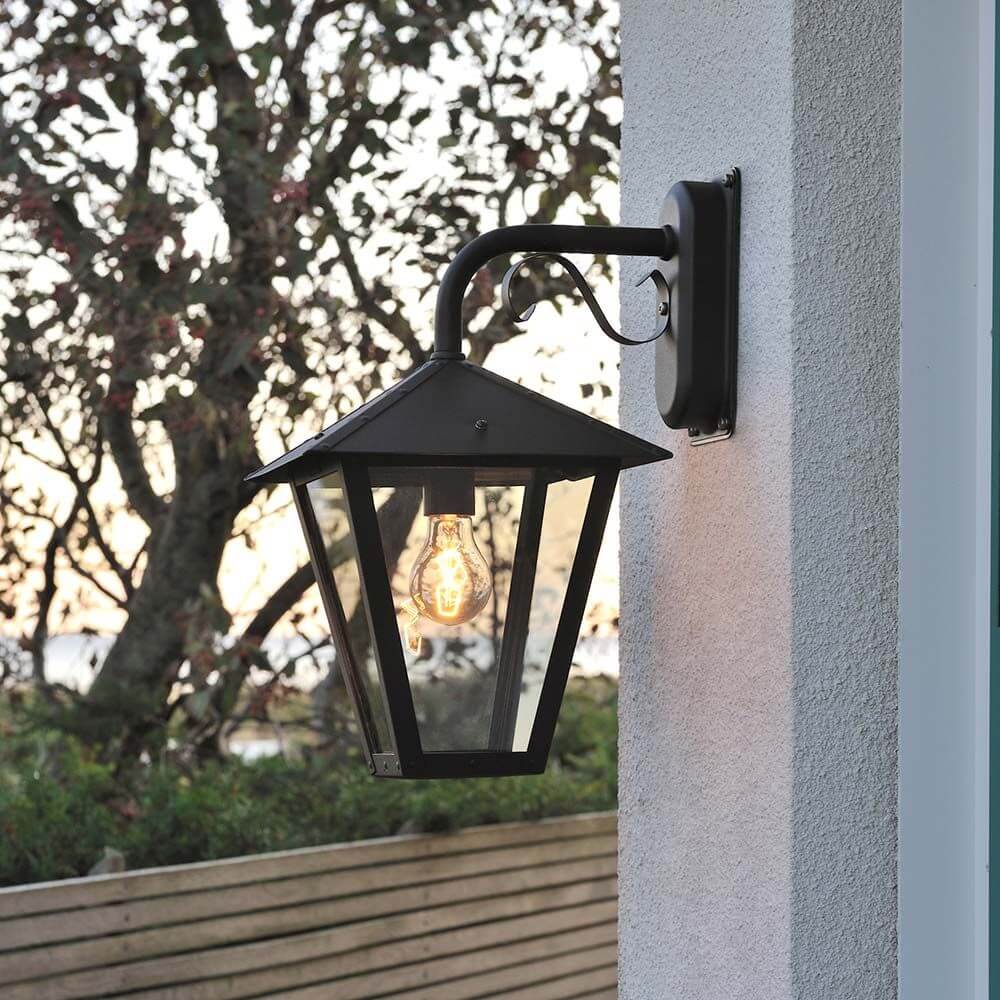 Benu outdoor wall lamp black, smoked acrylic glass mounted on the wall in the outdoor area.