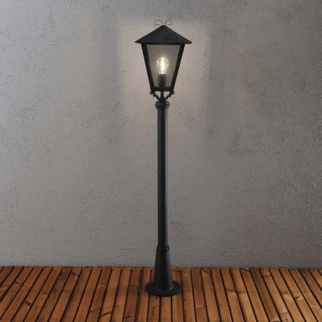 Benu lampada da giardino nera, vetro acrilico fumé su una base in legno, elegante illuminazione per esterni.