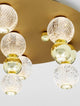 Brille LED Deckenleuchte 7-flammig Ø 66cm 3200K Gold mit elegantem Design und warmweißem Licht.