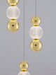 Brille LED Pendelleuchte 4-flammig Ø 30cm 3200K Gold mit eleganten goldenen und gläsernen Elementen.