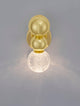 Brille LED Wandleuchte 3200K Gold mit goldener Oberfläche und eleganter Lichtkugel.