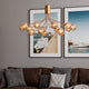 Galax Hängeleuchte 15-flammig in modernem Design mit hochwertigen Glasschirmen über einer gemütlichen Couch.