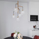 Grace Hängeleuchte 5-flammig in modernem Design mit klaren Glasschirmen über einem Esstisch.