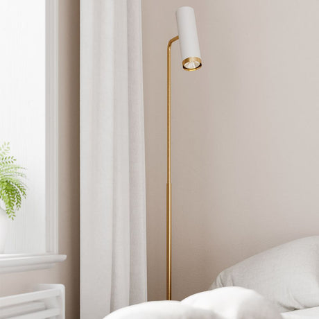 Puls floor lamp gold in a modern bedroom with a white lampshade and gold metal tripod