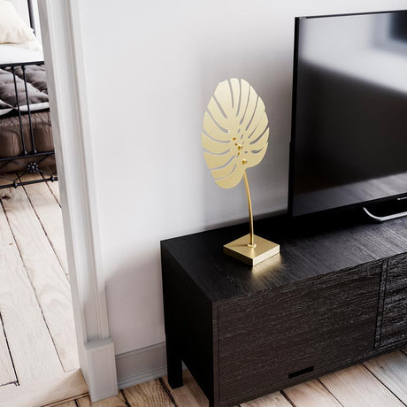 Table lamp Costa Rica 55 cm brass on a table next to a television in a modern living room.