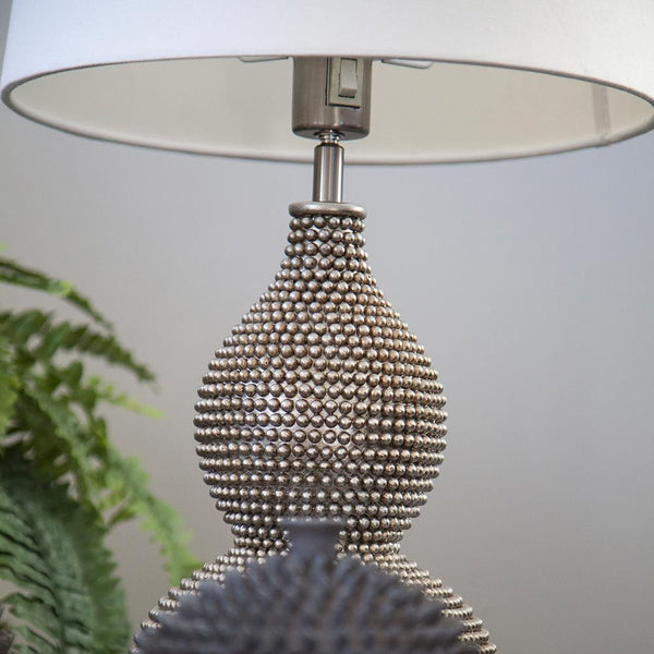 Lofty Orient-style table lamp with an exclusive base with an oriental look and a modern shade.