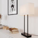 Moderne bordlampe Luton hvit med svart sokkel og hvit lampeskjerm, ideell for stilfulle interiører.
