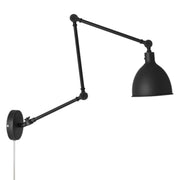 Läslägglampa Bazar sandsvart monterad på en vägg, idealisk för mysig läsning.