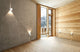 Canto Kubi 2 LED Wandleuchte Seaside IP44 in modernem Wohnraum mit Holz und Beton