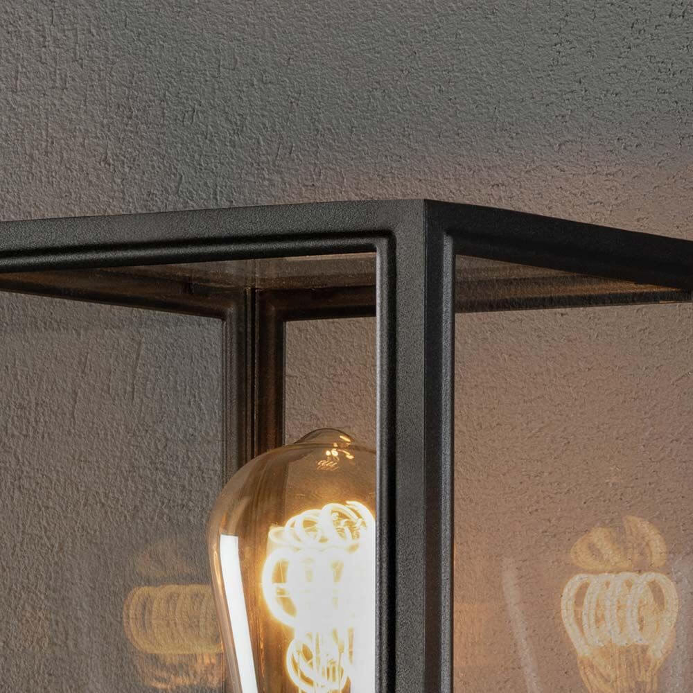 Detailansicht der Carip Pollerleuchte Schwarz aus Stahl mit klarem Glas und E27 Fassung.