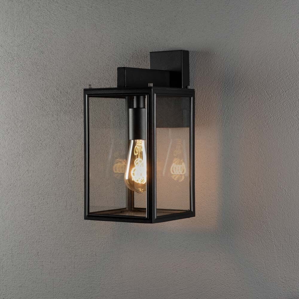 Carpi Wandleuchte Laterne in Schwarz mit klarem Glas, vielseitig montierbar für Außenbereich.