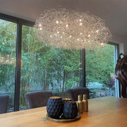 Catellani & Smith Fil de Fer Nuvola LED pendant light wire mesh in a modern living room.