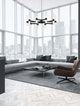 Moderne Wohnzimmer mit Century Pendelleuchte 12-flammig Ø 70cm Schwarz, Transparent über Schlafsofa und Tisch.