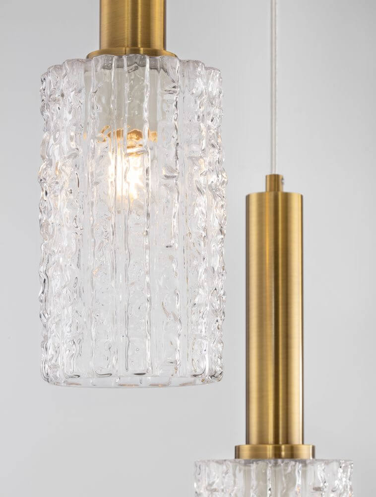 Certa Pendelleuchte 3-flammig Ø 30cm Schwarz, Gold mit transparentem Glaszylinder und goldenen Akzenten.