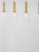 Certa Pendelleuchte 4-flammig Schwarz, Gold mit transparenten Glaszylindern und goldenen Aluminiumrohren.