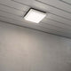 Cesena LED Außen Wand- & Deckenlampe Eckig Weiß montiert an der Decke mit grauer Wand im Hintergrund.