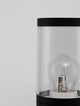Detailansicht der Cetera Außenwegeleuchte Schwarz IP54 mit transparenter Abdeckung und Sicht auf die Lampe.