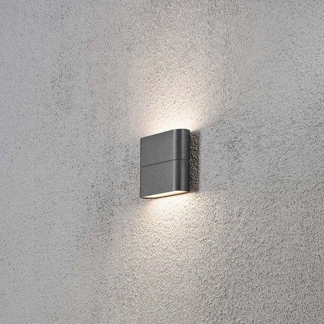 Chieri LED outdoor wall light anthracite, opal acrylic glass mounted on a wall with soft light.