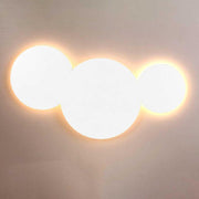 s.luce Cloud indirect LED wall light combination with three round lampshades in a light design
