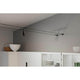 Kit de montage CorDuo pour système de câbles raccord mural noir mat installé sur un mur au design moderne.