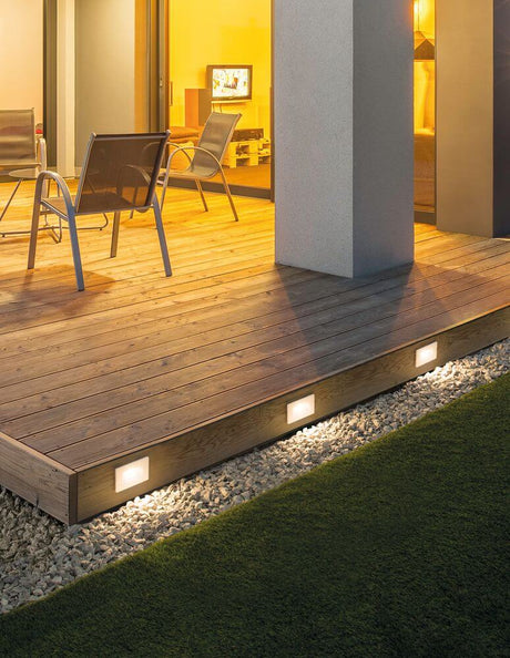 Cove LED outdoor wall recessed light Horizontal 3000K white IP54 on a modern wooden terrace.
