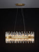 Crown Pendelleuchte 10-flammig Gold-Satiniert mit eleganten Kristallglasstäben und satin-goldenem Metallband.