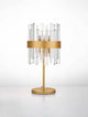 Crown Tischleuchte Gold mit elegantem Design und transparenten Acrylstäben, perfekt für moderne Innenräume.