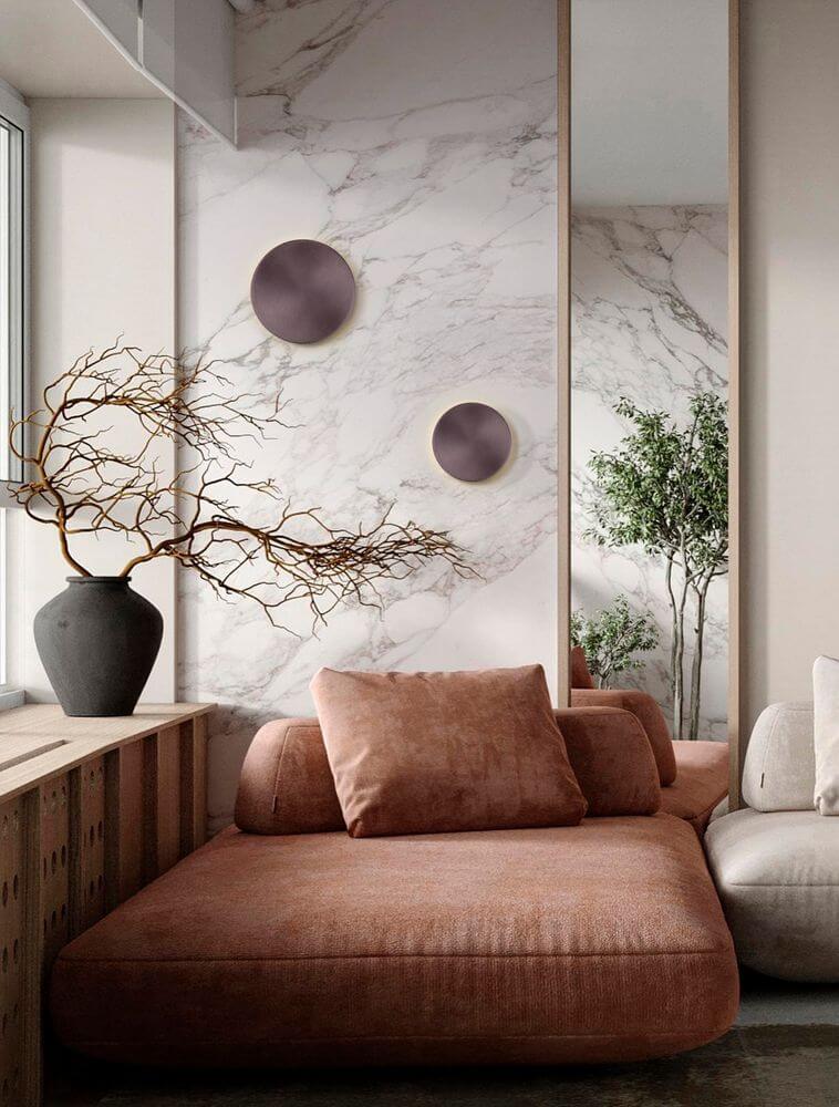 Cyrcle LED Wandleuchte Ø 30cm 3000K an einer elegant gestalteten Wand im Wohnzimmer