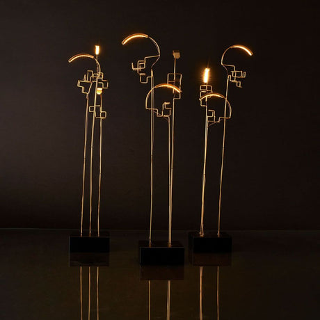 DCWéditions Boucle LED Akku Tischlampe schwarz Gold - moderne Designlampen in einem stilvollen Raum