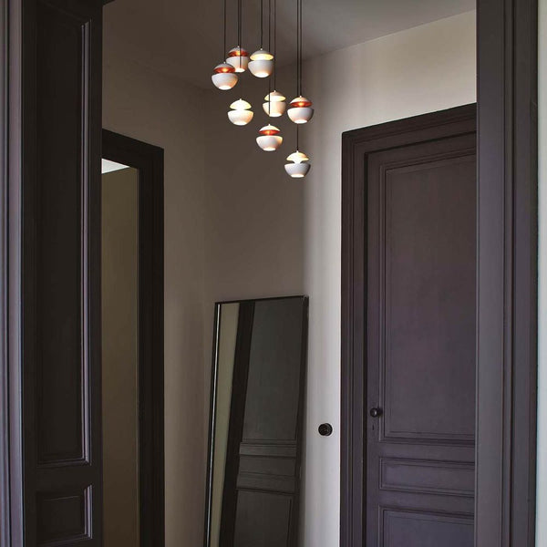 DCWéditions Here Comes The Sun Ø 10cm Mini LED pendant light in a modern interior with mirror.