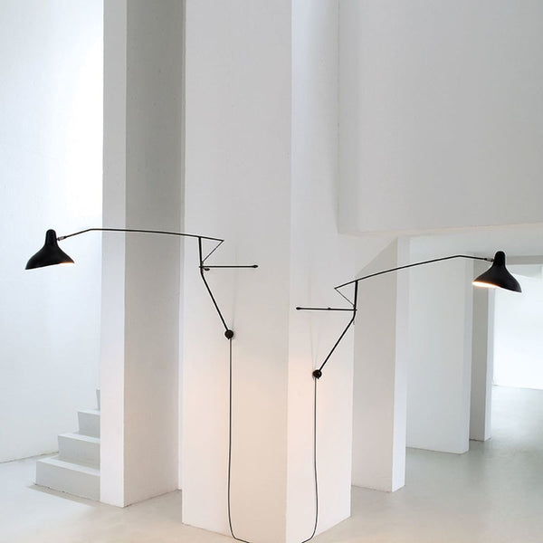 DCWéditions Mantis BS2 wall light with arm in a modern room, unique design, elegant and functional.