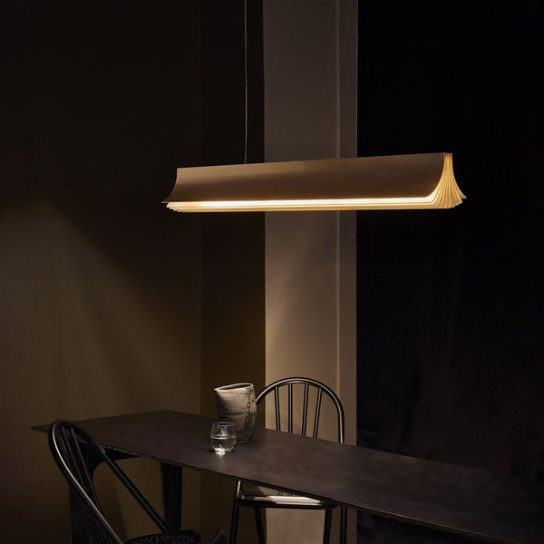 DCWéditions Respiro LED pendant light 90 cm above a dark table with chairs.