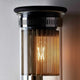 Detailansicht der DCWéditions Wandleuchte In The Tube 120-1300 mit Borosilikatglas und Lampenelement.