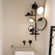 DCWéditions Tell Me Stories LED Wandleuchte mit Spiegeln und Ablagen in modernem Design.