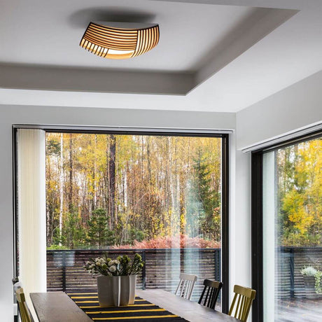 Modern Kuulto 9100 wooden ceiling light 52 cm in a dining area with a view of nature.