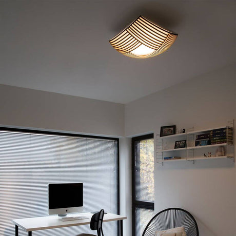 Kuulto 9100 wooden ceiling light 52 cm in a modern room, emits warm light.