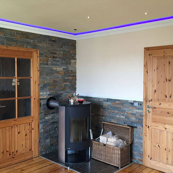Decorative light coving profile 118cm for indirect LED lighting in a modern room with a fireplace.