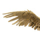 Detailansicht einer goldenen Vogelwinge, kreative Dekoration für stilvolle Innenräume.