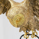 Detailansicht der Design Hängeleuchte Owl mit goldener Eule und filigranen Flügeln.