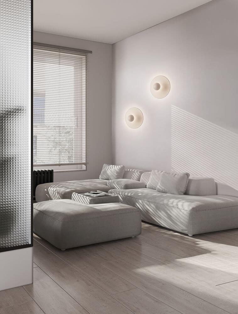 Edem LED Wandleuchte Ø 25cm 3000K an einer modernen Wand im Wohnzimmer